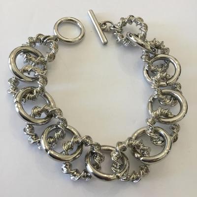 Very nice silver toned toggle bracelet. Very nice quality.