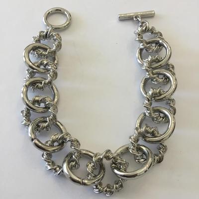 Very nice silver toned toggle bracelet. Very nice quality.