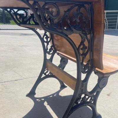 Sale Photo Thumbnail #26: Early 1900s Sears & Roebuck folding chair/desk combo with cast iron frame and solid wood seat, back, and desktop. Beautifully crafted with ornate side detailing and smooth folding seat. Great condition, clean wood surfaces and free of rust.