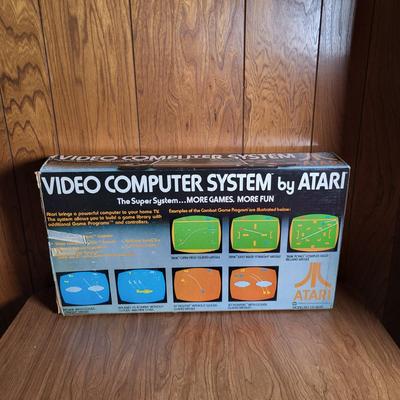LOT 56L: Vintage Orignal Atari Videogame System in Box with Game Log, Owners Manual and Two Controllers