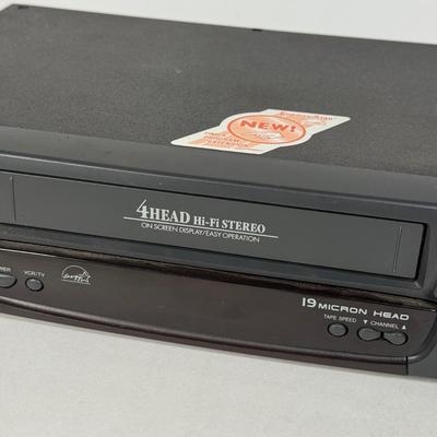 LOT 115D: Syvania VCR Model 2965LF w/ Collection of DVDs