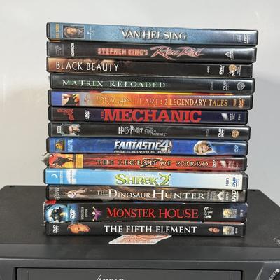 LOT 115D: Syvania VCR Model 2965LF w/ Collection of DVDs