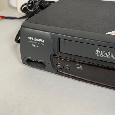 LOT 115D: Syvania VCR Model 2965LF w/ Collection of DVDs