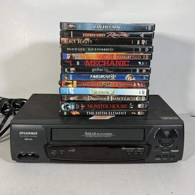 LOT 115D: Syvania VCR Model 2965LF w/ Collection of DVDs
