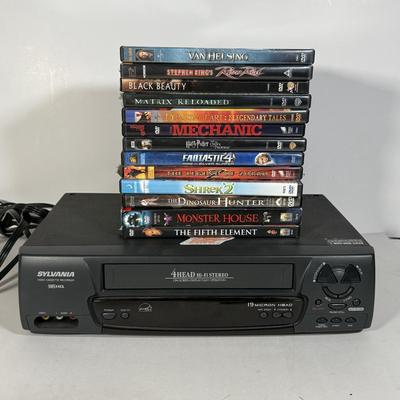 LOT 115D: Syvania VCR Model 2965LF w/ Collection of DVDs