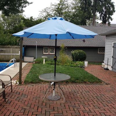 LOT 139: Glass Outdoor Table with Adjustable Umbrella & Stand