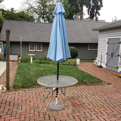 LOT 139: Glass Outdoor Table with Adjustable Umbrella & Stand