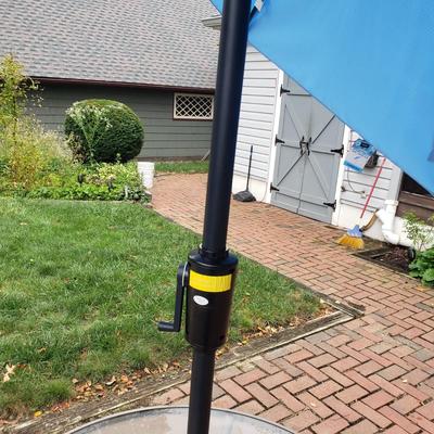 LOT 139: Glass Outdoor Table with Adjustable Umbrella & Stand
