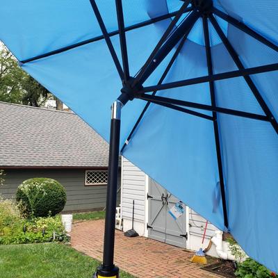 LOT 139: Glass Outdoor Table with Adjustable Umbrella & Stand