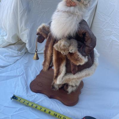 Sale Photo Thumbnail #48: Vintage santa figurine, barcode label on bottom says "Chippendale". Figurine is holding a bell and small teddy bear and has a removable hat. Approximately 10"x8" base and 22" tall.