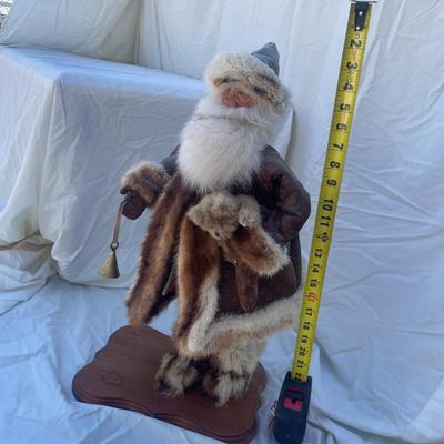 Sale Photo Thumbnail #50: Vintage santa figurine, barcode label on bottom says "Chippendale". Figurine is holding a bell and small teddy bear and has a removable hat. Approximately 10"x8" base and 22" tall.