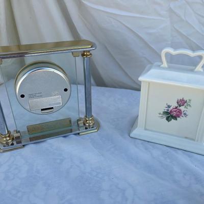 Sale Photo Thumbnail #100: 3 antique battery operated table clocks, selling as a set. Front clock is carved glass, approximately 3"x2"x3". Back left clock is set in glass with gold and silver accents, has "Mom & Dad" etched into gold plate beneath face, and is approximately 6"x1"x6