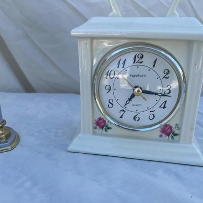 Sale Photo Thumbnail #98: 3 antique battery operated table clocks, selling as a set. Front clock is carved glass, approximately 3"x2"x3". Back left clock is set in glass with gold and silver accents, has "Mom & Dad" etched into gold plate beneath face, and is approximately 6"x1"x6