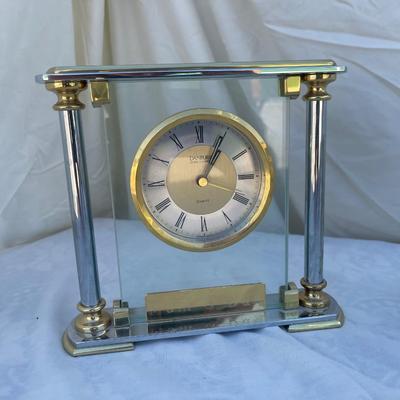 Sale Photo Thumbnail #99: 3 antique battery operated table clocks, selling as a set. Front clock is carved glass, approximately 3"x2"x3". Back left clock is set in glass with gold and silver accents, has "Mom & Dad" etched into gold plate beneath face, and is approximately 6"x1"x6