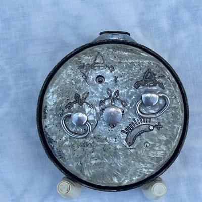 Sale Photo Thumbnail #107: Vintage Soviet Travel Alarm Clock, 11 Jewels brand. Approximately 2.5"x1"x2.5". Wind up details on back. In good condition, a very cool piece of history!