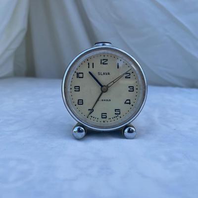 Sale Photo Thumbnail #104: Vintage Soviet Travel Alarm Clock, 11 Jewels brand. Approximately 2.5"x1"x2.5". Wind up details on back. In good condition, a very cool piece of history!