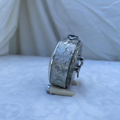 Sale Photo Thumbnail #106: Vintage Soviet Travel Alarm Clock, 11 Jewels brand. Approximately 2.5"x1"x2.5". Wind up details on back. In good condition, a very cool piece of history!