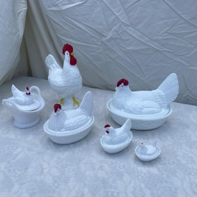 Sale Photo Thumbnail #117: Westmoreland Milk Glass Hen on Nest covered dishes, selling as a set of 6. Includes a rooster and 5 hens of various sizes. Good condition, a few scratches and chips here and there. Very cool set with "WC" (Westmoreland Co) logo inside each lid.