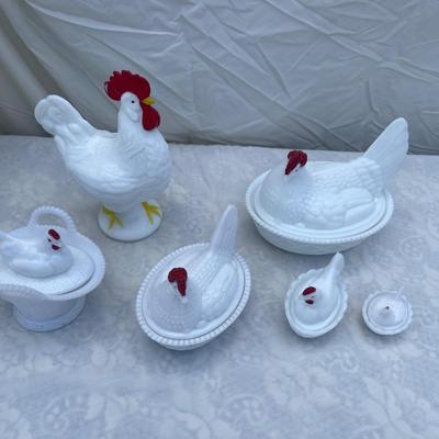 Sale Photo Thumbnail #118: Westmoreland Milk Glass Hen on Nest covered dishes, selling as a set of 6. Includes a rooster and 5 hens of various sizes. Good condition, a few scratches and chips here and there. Very cool set with "WC" (Westmoreland Co) logo inside each lid.
