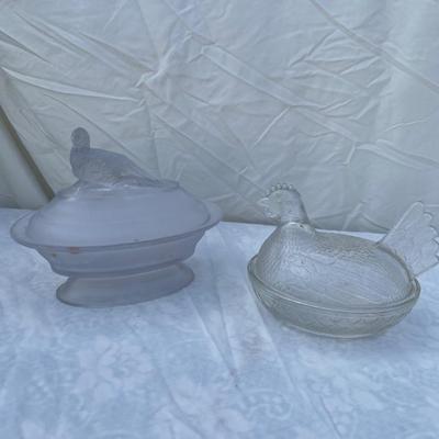 Sale Photo Thumbnail #125: Vintage glass dishes with bird lids, selling as set of 2. Could use a good scrub, but otherwise in great condition. Left dish is approximately 6"x4"x7" including foot and bird ornament with lightly frosted glass. Right dish is approximately 6"x4"x5".