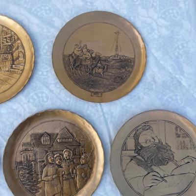 Sale Photo Thumbnail #135: 9 vintage Wendell August Forge Limited Edition Christmas Plates, years 1981-1988. Duplicates of 1985 and 1986, missing 1987. Various Christmas designs on solid brass plates with dimpled texture. In good condition and each plate has a small hook on the bac