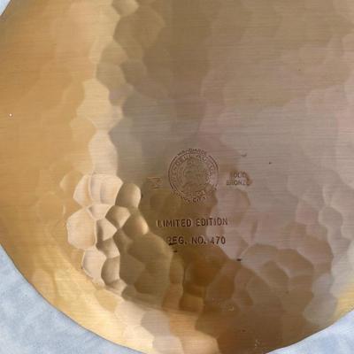 Sale Photo Thumbnail #142: 9 vintage Wendell August Forge Limited Edition Christmas Plates, years 1981-1988. Duplicates of 1985 and 1986, missing 1987. Various Christmas designs on solid brass plates with dimpled texture. In good condition and each plate has a small hook on the bac