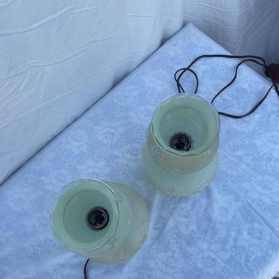 Sale Photo Thumbnail #149: Vintage mint green glass lamps, selling as a set of 2. Each takes a standard bulb and has a short cable ending in a 2 prong plug. Fair quality, color is slightly faded/dirty and the top piece of one lamp is chipped where it sits on the stem. Could use som