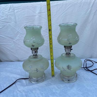 Sale Photo Thumbnail #151: Vintage mint green glass lamps, selling as a set of 2. Each takes a standard bulb and has a short cable ending in a 2 prong plug. Fair quality, color is slightly faded/dirty and the top piece of one lamp is chipped where it sits on the stem. Could use som