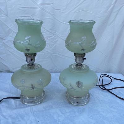 Sale Photo Thumbnail #148: Vintage mint green glass lamps, selling as a set of 2. Each takes a standard bulb and has a short cable ending in a 2 prong plug. Fair quality, color is slightly faded/dirty and the top piece of one lamp is chipped where it sits on the stem. Could use som
