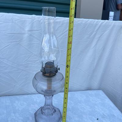 Sale Photo Thumbnail #156: Antique Glass Oil Lamp with wick and removable glass chimney. Approximately 5" base and 21" height (including glass chimney). Funky size and great condition!