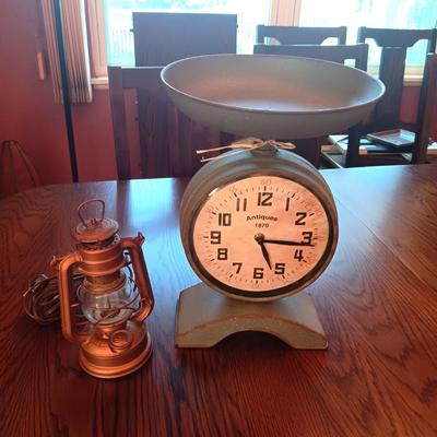 BATTERY OPERATED CLOCK THAT LOOKS LIKE OLD SCALE & A SUPER BABY FEUERHAND LANTERN MADE INTO A LAMP