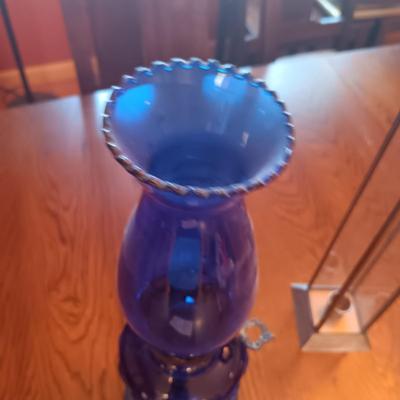 BLUE GLASS OIL LAMP AND A CANDLE LANTERN