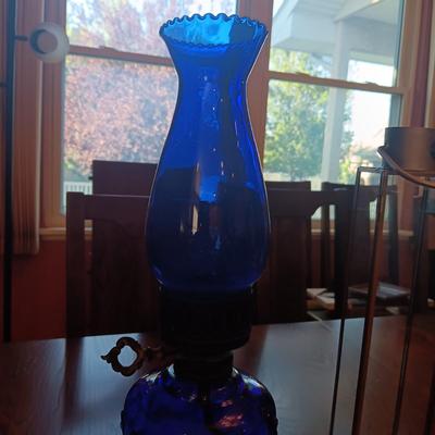 BLUE GLASS OIL LAMP AND A CANDLE LANTERN