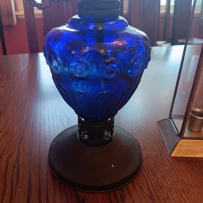 BLUE GLASS OIL LAMP AND A CANDLE LANTERN
