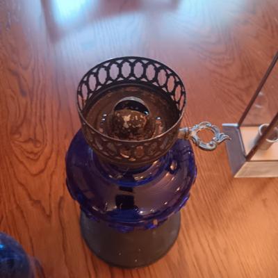 BLUE GLASS OIL LAMP AND A CANDLE LANTERN