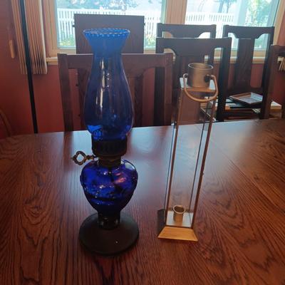 BLUE GLASS OIL LAMP AND A CANDLE LANTERN