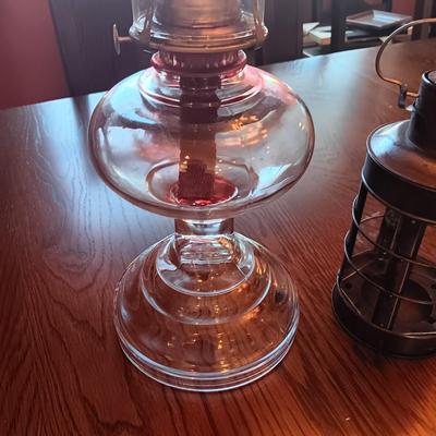 TALL GLASS OIL LAMP AND A CANDLE LANTERN