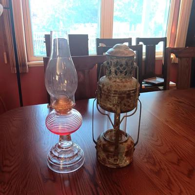 RIBBED GLASS OIL LAMP AND A REPRODUCTION METAL LANTERN