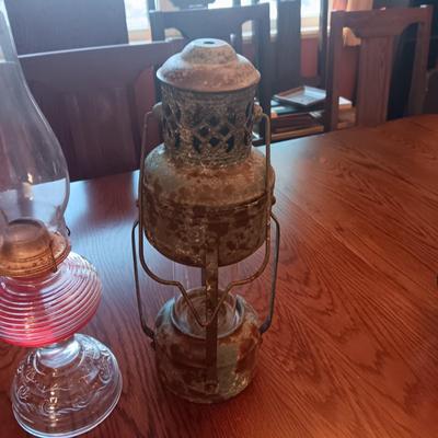 RIBBED GLASS OIL LAMP AND A REPRODUCTION METAL LANTERN