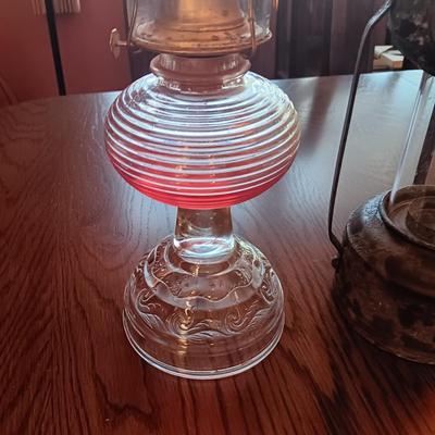 RIBBED GLASS OIL LAMP AND A REPRODUCTION METAL LANTERN