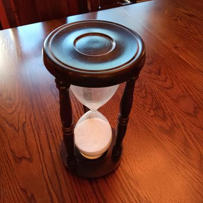 AN ART DECO STYLE ALARM CLOCK AND AN HOUR GLASS