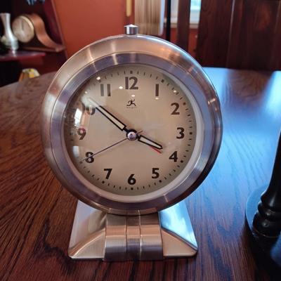 AN ART DECO STYLE ALARM CLOCK AND AN HOUR GLASS