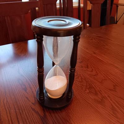 AN ART DECO STYLE ALARM CLOCK AND AN HOUR GLASS