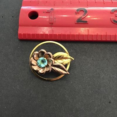 Gold tone rose, gold tone, lapel pin with aqua blue rhinestone