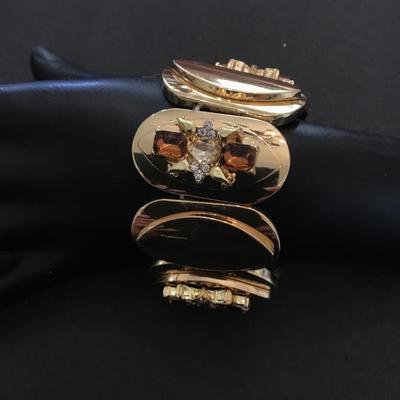 Beautiful gold tone, stretchy bracelet with Multi colored, rhinestones