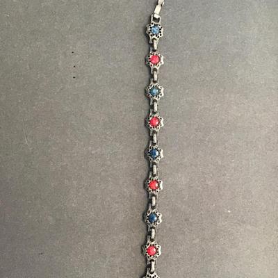Very nice vintage, gunmetal color bracelet with red and blue rhinestones