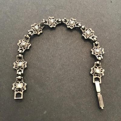 Very nice vintage, gunmetal color bracelet with red and blue rhinestones