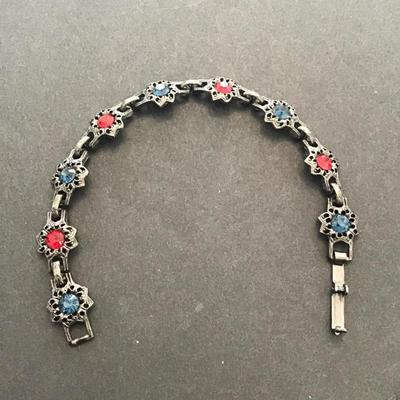 Very nice vintage, gunmetal color bracelet with red and blue rhinestones