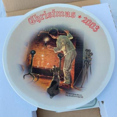 Sale Photo Thumbnail #197: This is a Limited Edition Norman Rockwell Christmas Plate from 2003, featuring the artwork titled "Waiting for Santa". 
This collectible plate is the 2003 issue of the Christmas Collection. 
It was crafted by Knowles China and approved by the Norman Rockw