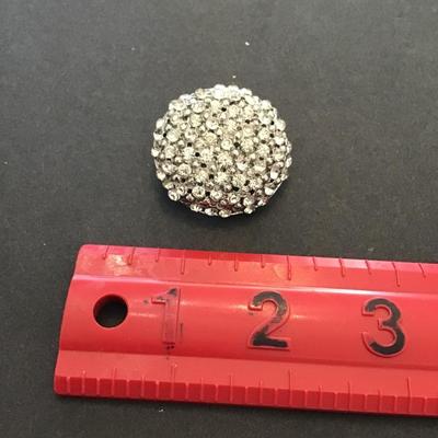 Silver tone brooch with clear rhinestones